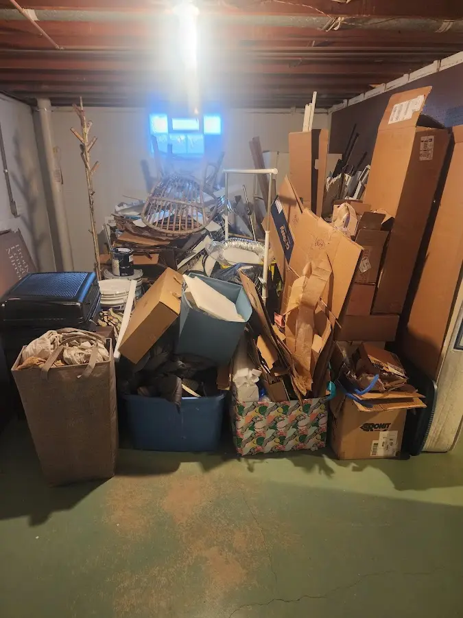 Roll-off dumpster container at job site for 2 Yard Dumpster Rental in Chisholm